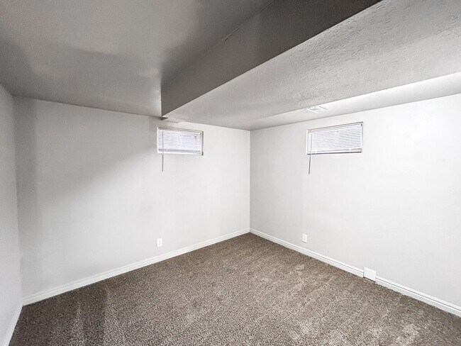 Building Photo - Spacious 5-Bedroom Home with Lofted Garage