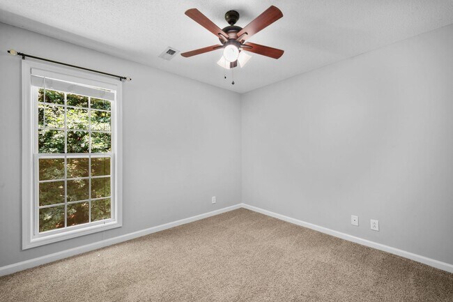 Building Photo - Stunning Stone Fireplace • Finished Basement • Fenced Yard