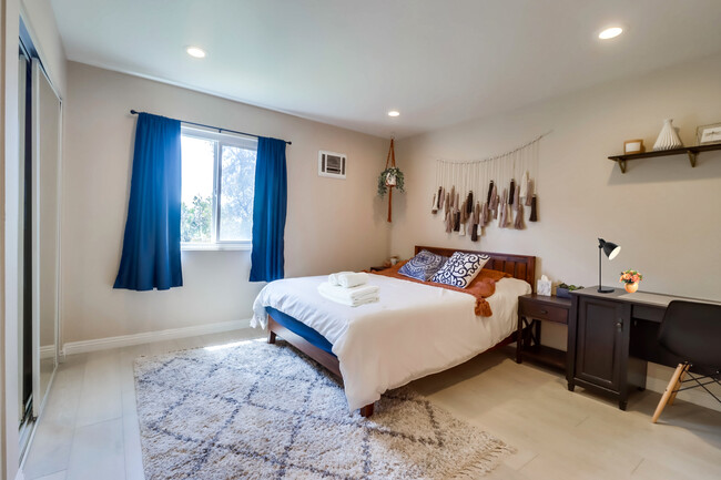 Recharge in this cloud-like queen bed in Bedroom 2 w/ a nearby workspace - 524 Telegraph Canyon Rd