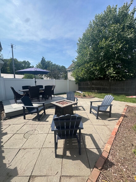 large fenced in back yard with table/chairs, fire pit, grill - 175 Lake Ave
