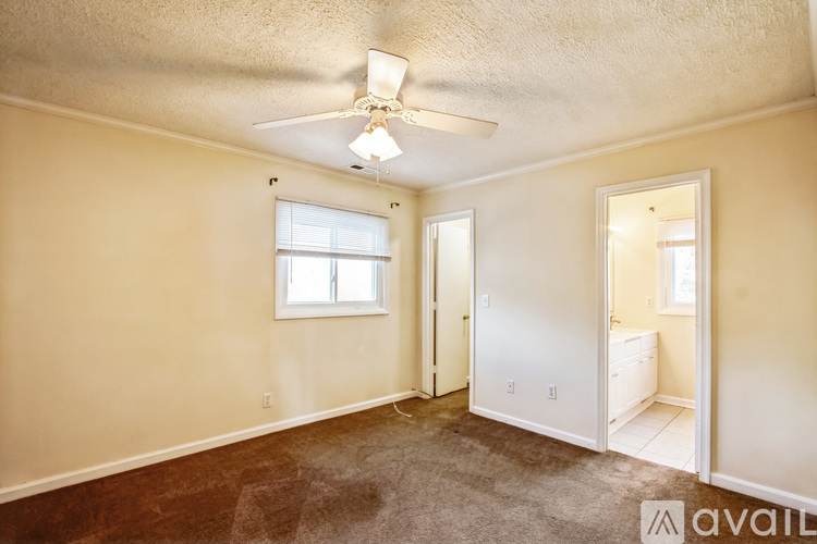 Primary bedroom with walk in closet and attached bathroom - 1602 Monticello Rd