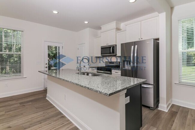 Building Photo - End Unit Townhome | Back Patio with Privac...