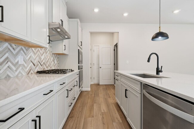 Building Photo - Move-In Ready 4BR Home | Deck, Patio & Open Concept Living