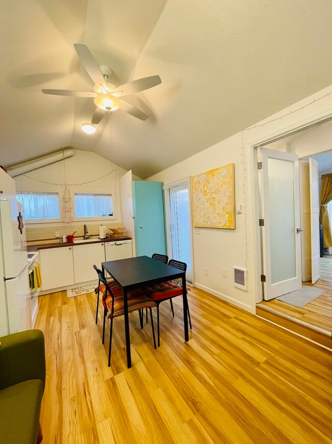 Washer dryer and shelving behind the blue door - 3405 NE 80th Ave