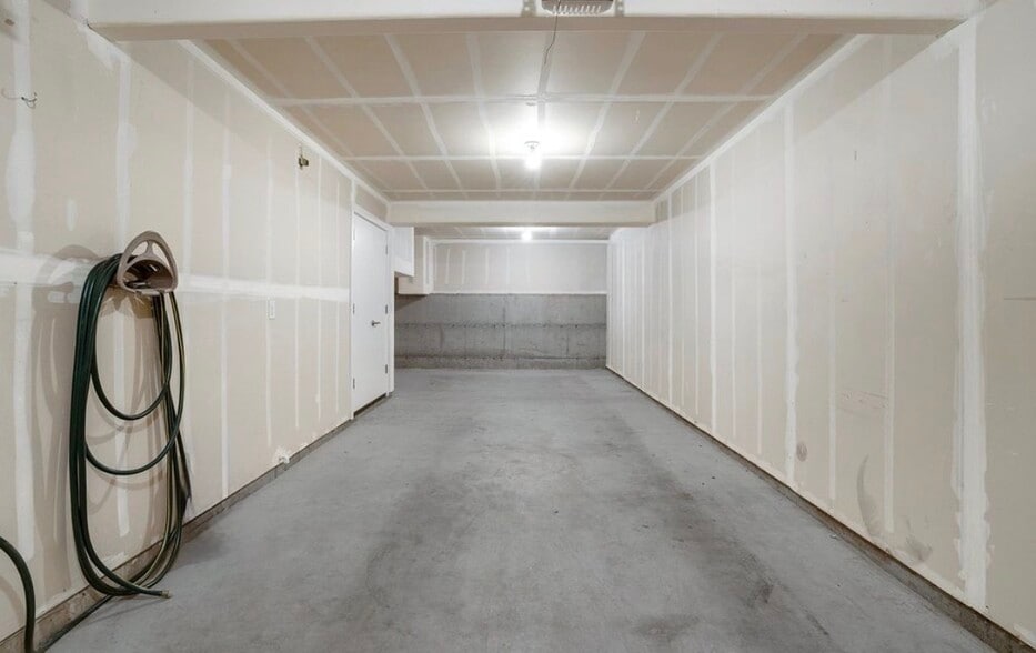 2 car garage with garden hose connection and backdoor to access the backyard - 13102 SW Aubergine Ter