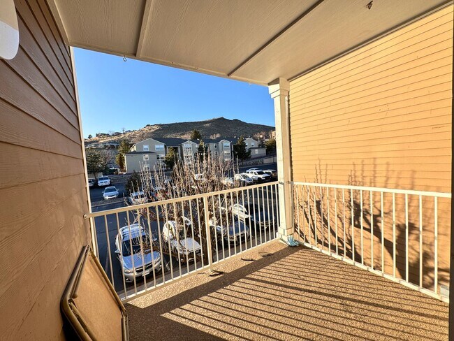Building Photo - Home Near UNR: Spacious 4BR/4BA with Gated Access and Balcony!