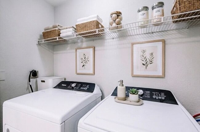 Building Photo - Spacious 2-Bedroom Elite Apartment with Private Balconies & Washer/Dryer