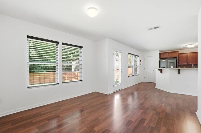 Building Photo - Spacious 4BR Home with New Carpet & Fenced Backyard