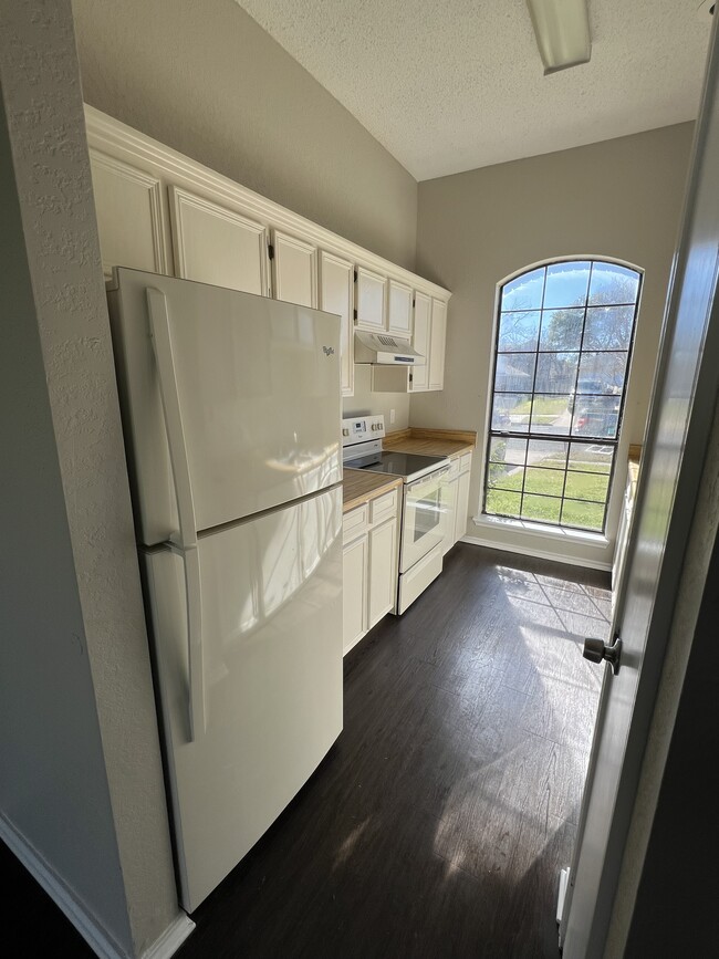 Kitchen with fridge - 2303 Cactus Dr