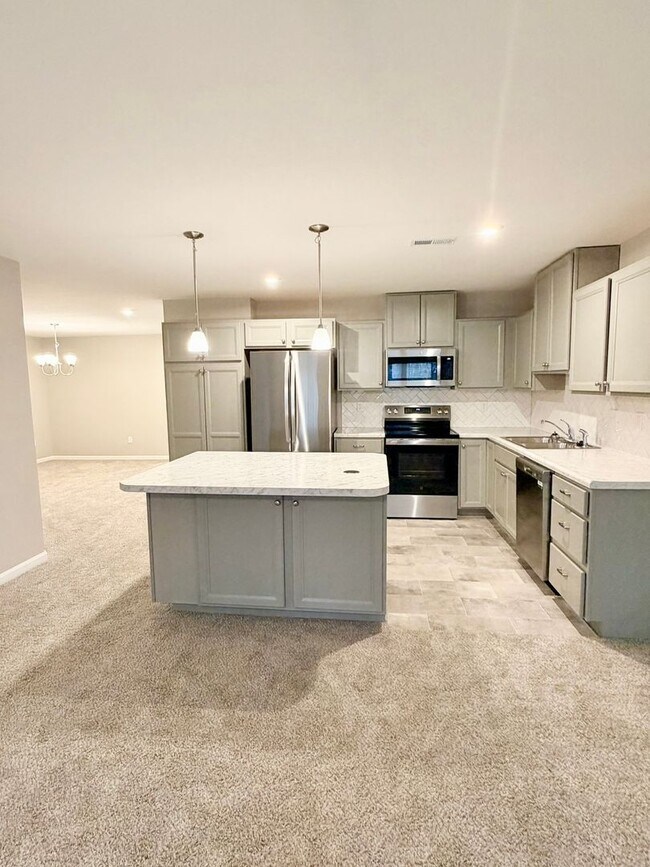 Building Photo - Exquisite brand new condo w/everything! Ground floor, no stairs, attached garage