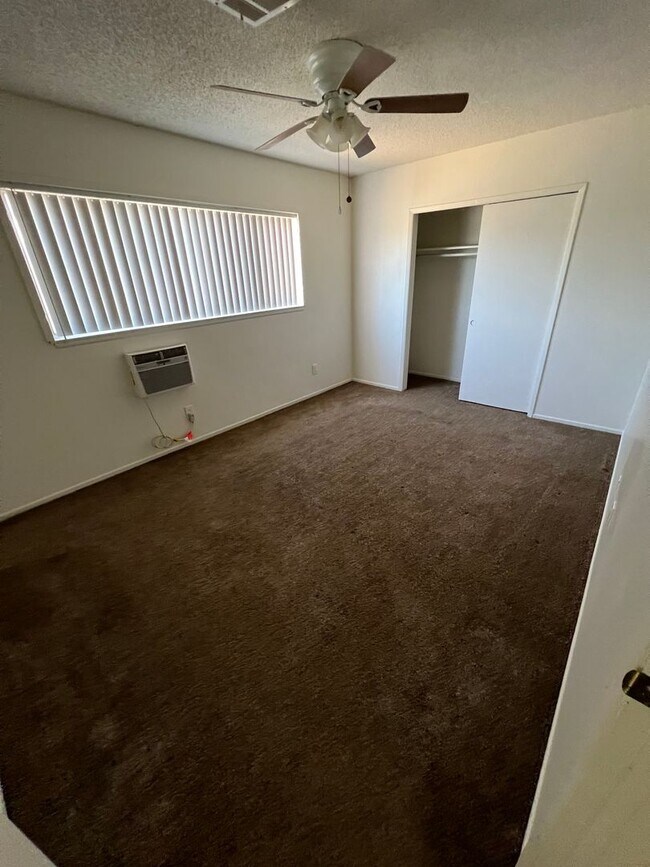 Building Photo - 4 bedroom 2 bath,  fenced yard w/ fruit tr...