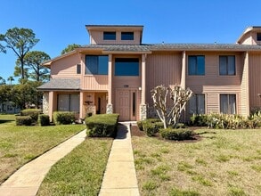 Building Photo - Light-Filled 2BR Condo in Gated Pelican Bay Near Golf, Beach & I-95