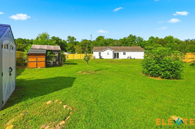 Building Photo - Beautiful Like-New 3 Bedroom Home with Huge Fenced Yard, Greenhouse & Storage