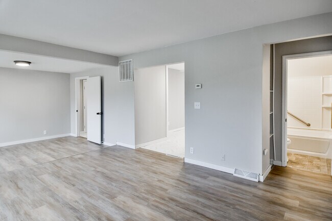 front door view towards mud room, kitchen, and bath - 208 Harlem Rd