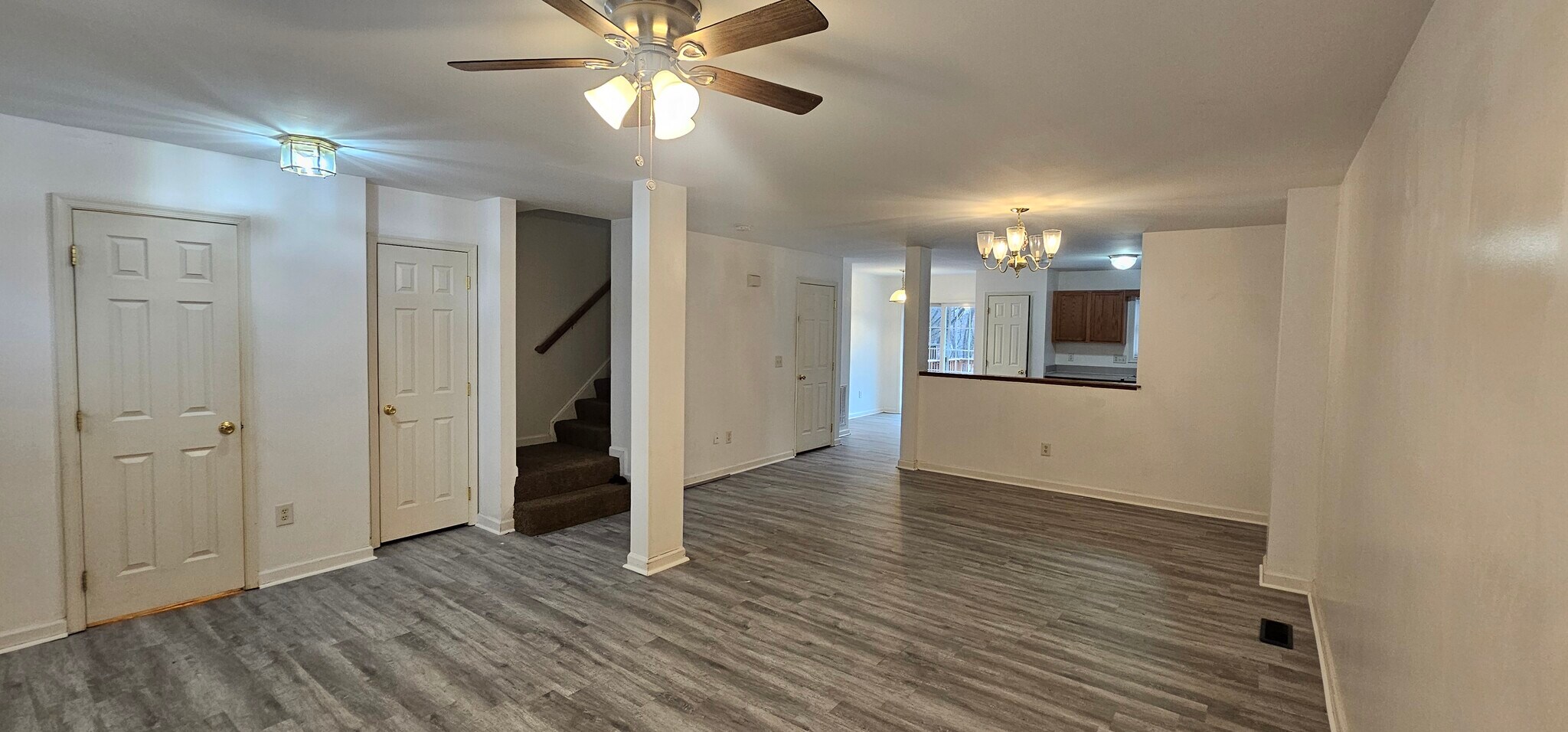 view from living room to dining and kitchen - 7 Lotus Dr