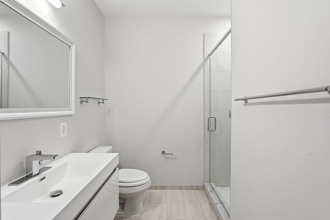 Building Photo - Experience modern living in this beautifully appointed junior one-bedroom/studio featuring an ope...