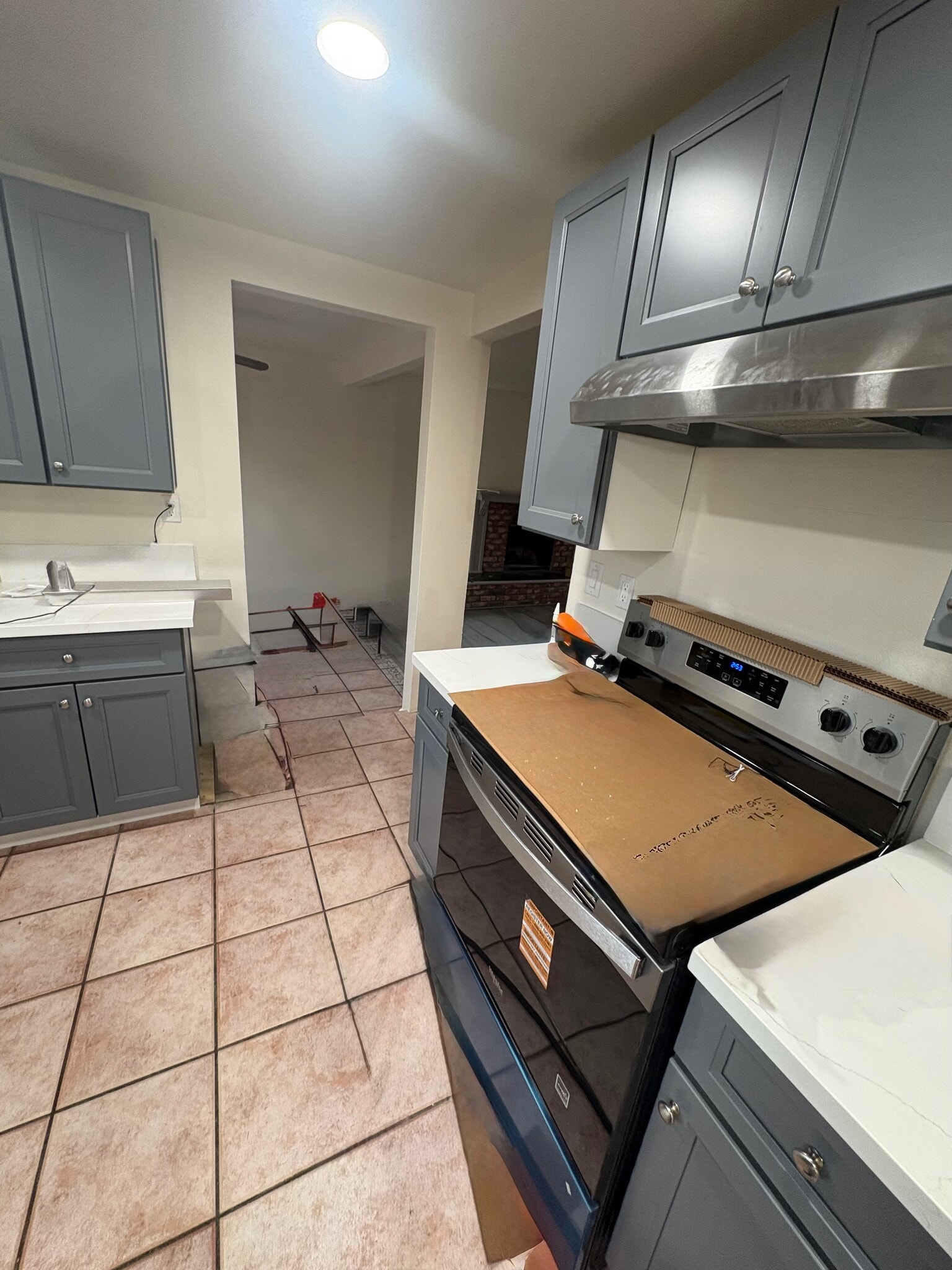 A little further left is the new electric stove and oven with new counters and new cabinets - 23162 Smith Rd