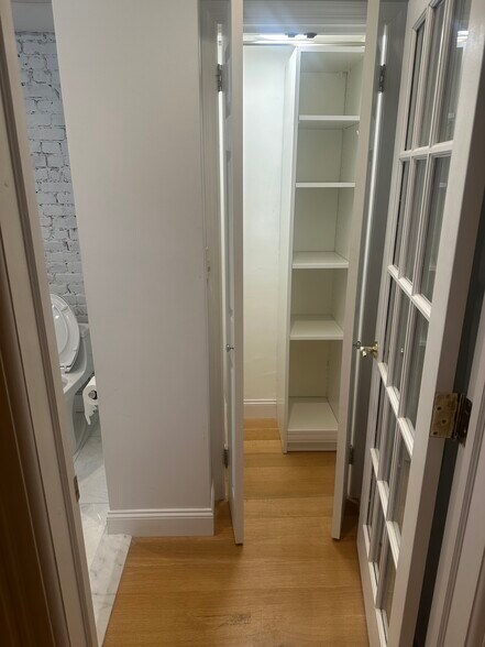Linen closet in bathroom - 30 Downing St