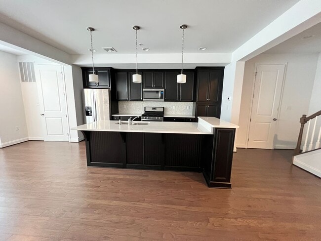 Building Photo - 2-bedroom 2.5 bath Luxury Townhome located...