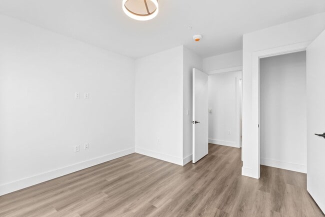 Building Photo - 2 Bedroom Corner-Unit with Wooded Balcony ...