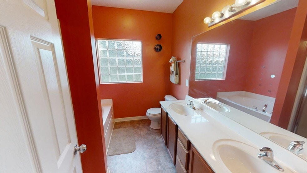 master bathroom with separate tub and shower - 1113 Shire Dr