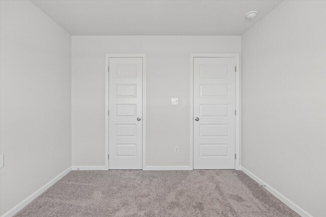Building Photo - New 3BR Home in Whispering Woods – Modern ...