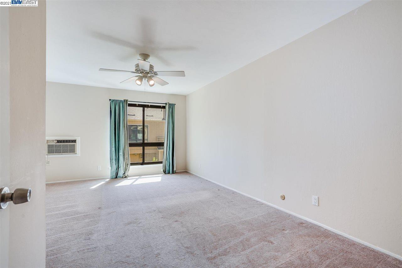 Primary bedroom with full closet - now has wooden flooring - 9005 Alcosta Blvd