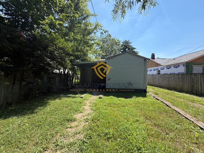 Building Photo - Charming 3-Bedroom Stone Bungalow with 2-Car Detached Garage & Fenced Yard, Available NOW!