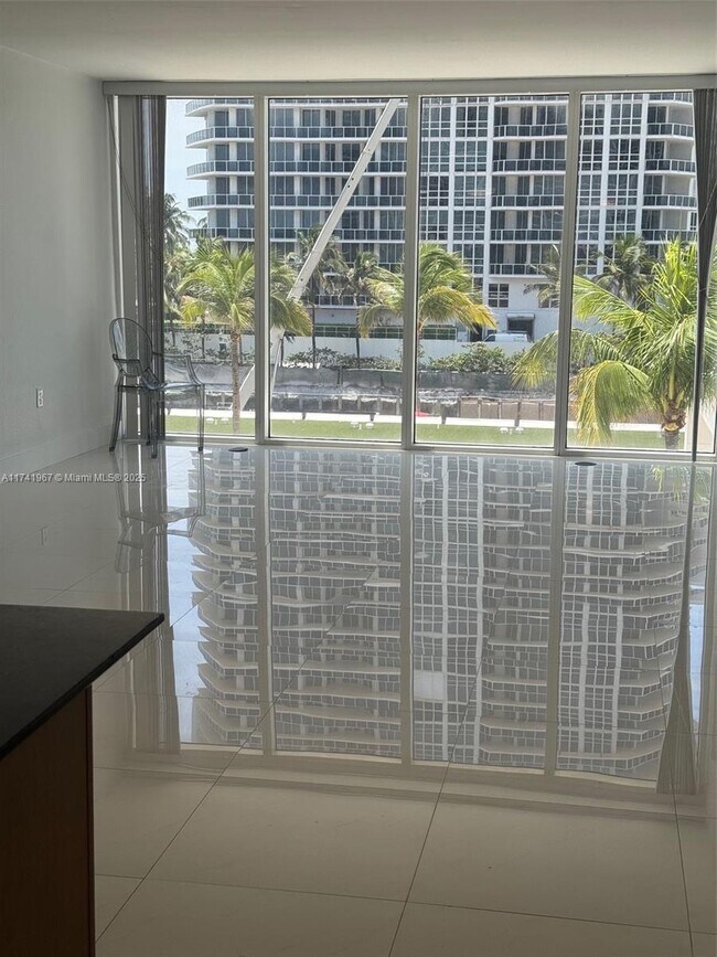 Building Photo - 10275 Collins Ave