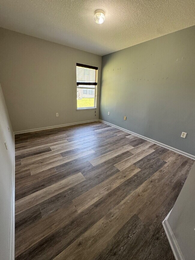 Building Photo - Spacious 4 Bedroom Pond-View Home with Upg...