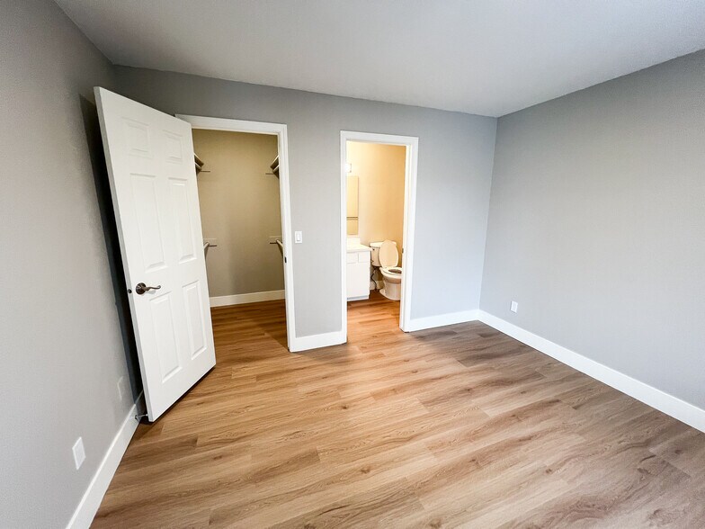 Bedroom 2 large walk in closet and en suite bathroom. - 6521 W Lucky Ln