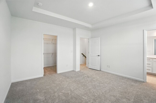 Building Photo - Brand-new three-story townhome in the Univ...