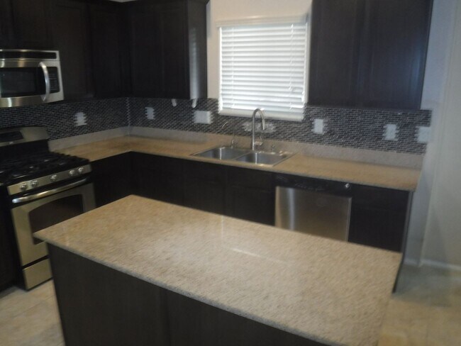 Building Photo - SPACIOUS 4 BEDROOM HOME WITH 2.5 BATHS, 2 ...
