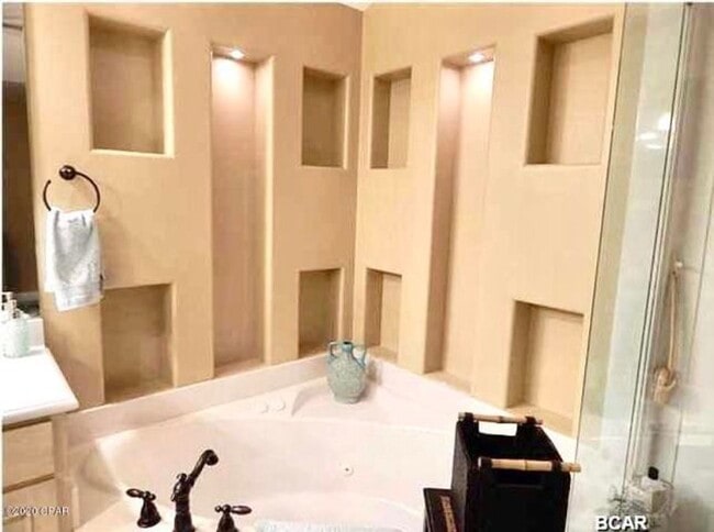 Building Photo - WATERFRONT W/BOAT SLIP!!!! This beautiful home is located in a gated community on North Lagoon Dr...