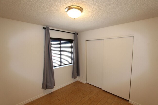 Building Photo - Ground-Level 2 Bedroom Condo in Pineview Village | Covered Parking + Storage