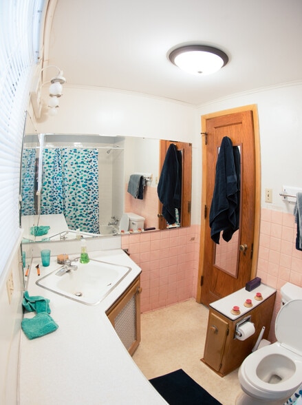 Radiator under the sink keeps you warm in the winter. - 430 E. Jefferson Street