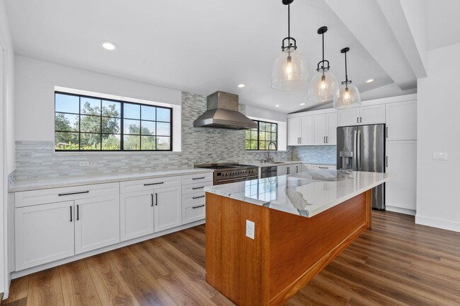 Building Photo - Beautifully renovated 4 bedroom home w/ pool