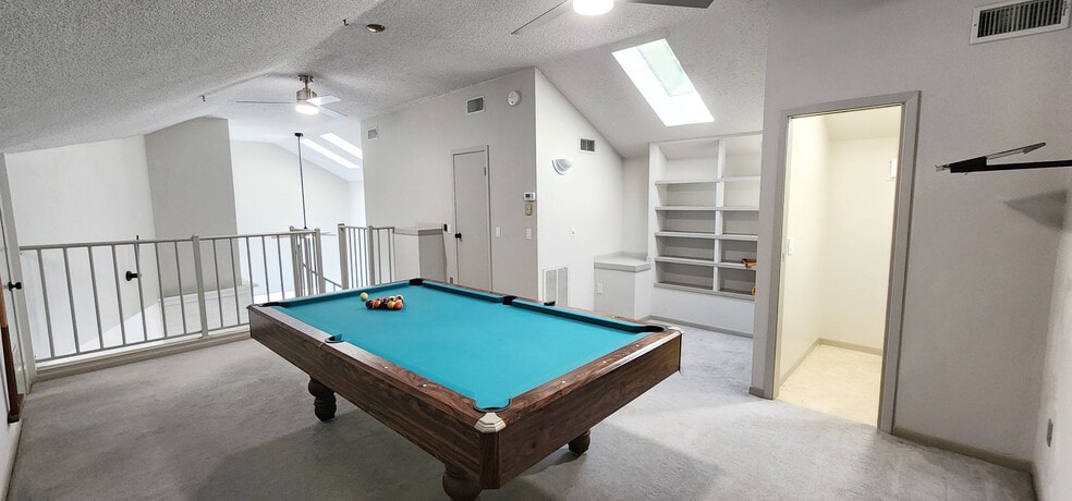 Spacious loft with pool table, skylight, bathroom, and bookshelf - 4722 Rainbow Run