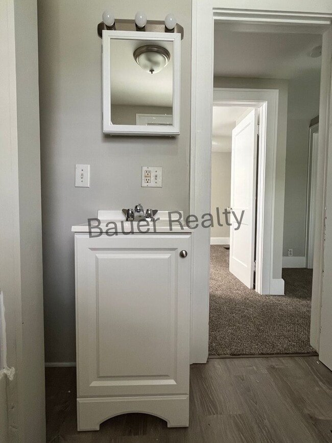 Building Photo - Three bedroom home with two car, detached garage!