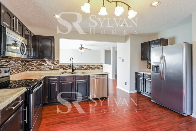 Building Photo - This lovely 4BR, 2.5BA home is move-in ready