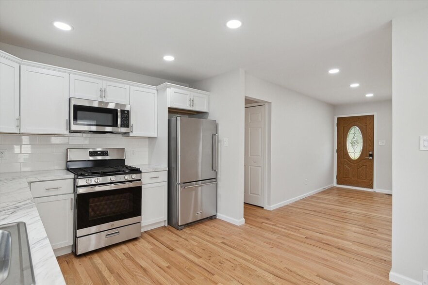 Newly renovated with cabinets and stainless steel appliances. - 9244 Northern Ave