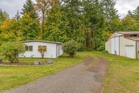 Building Photo - THREE BEDROOM MANUFACTURED HOME WITH SHOP