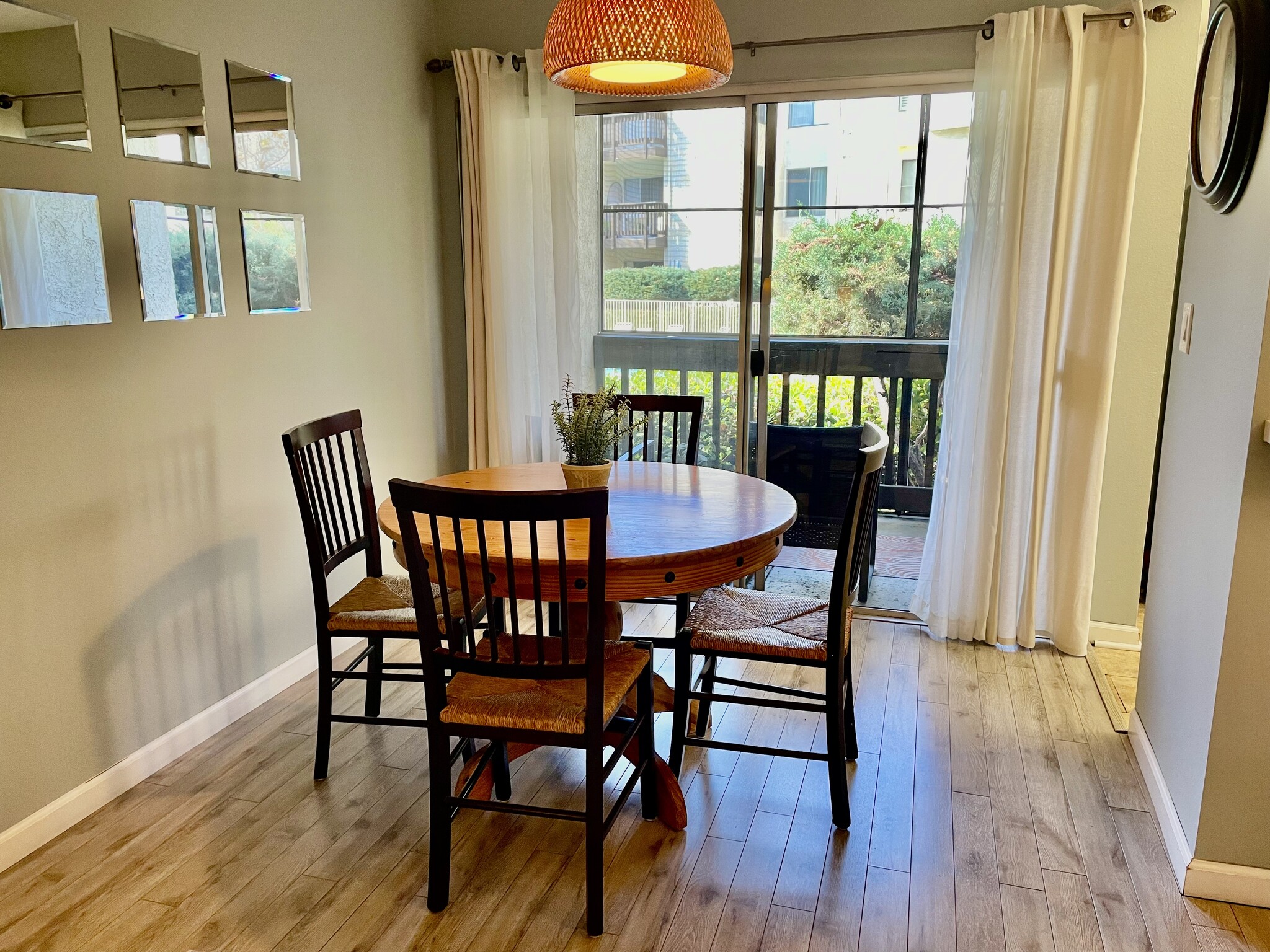 Dine with a view of the tree lined pool. - 4111 Summertime Ln