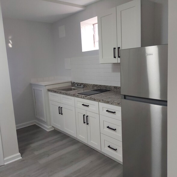 Kitchenette area with new appliances - 8527 Piney Point Ct