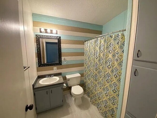 Building Photo - Charming 3 Bedroom Home in Quiet, Tree Lined Neighborhood