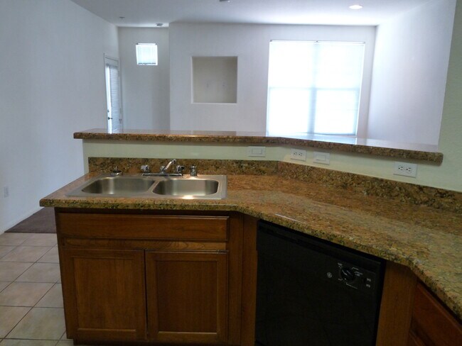 Building Photo - GATED 2 BEDROOM, 2 BATH CONDO IN JASMINE RANCH COMMUNITY