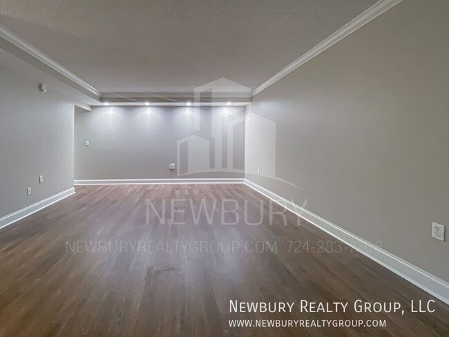 Building Photo - Luxury 1-Bedroom Penthouse with Modern Ren...