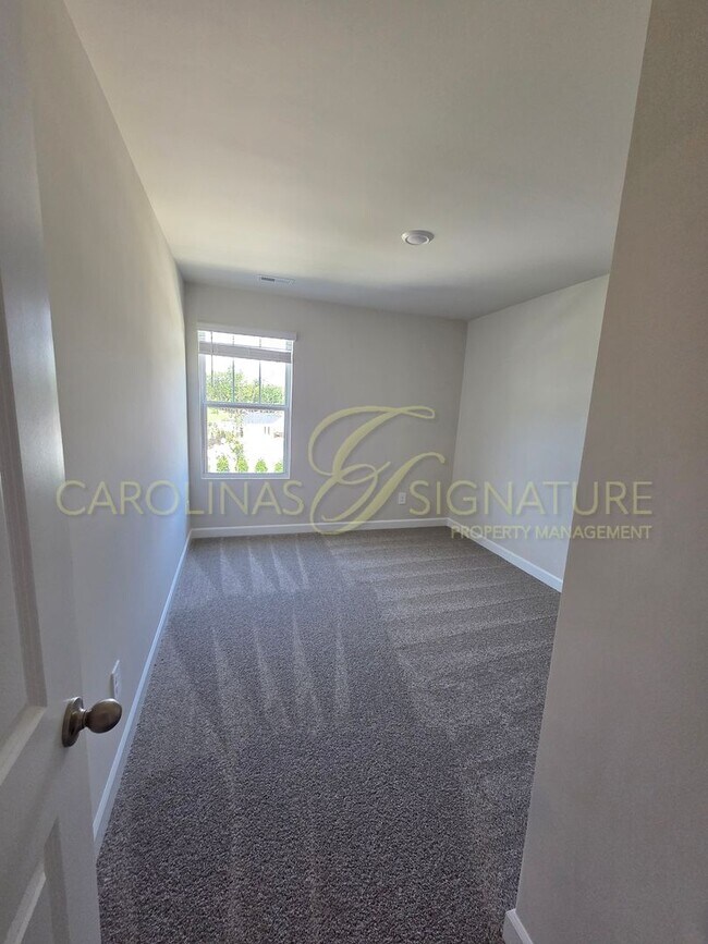 Building Photo - AVAILABLE SEPTEMBER 1! NEW CONSTRUCTION; 3...