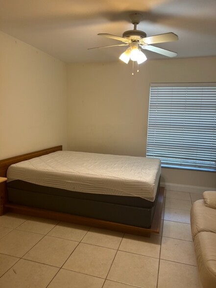 furnished queen bed with dresser and night stands - 480 NW 20th St