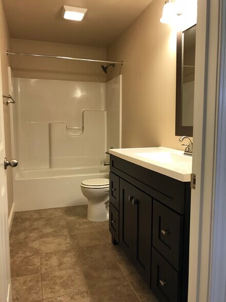 Main full bathroom with tile floors. - 104 Scenic Drive